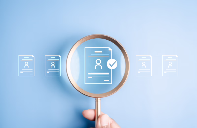 Human resources recruitment and hiring the right job candidate. Hand holding magnifying glass over resume document icon with checkmark for approval.